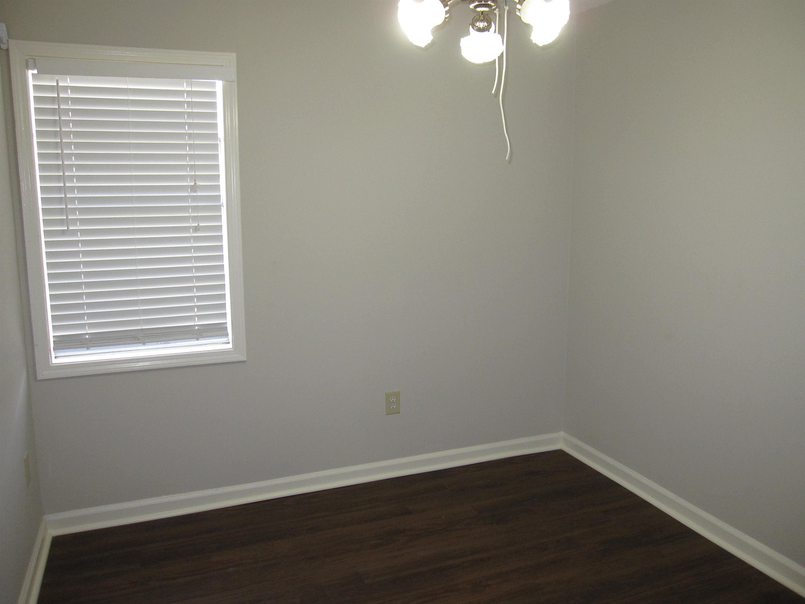 935 Poplar Leaf Road Collierville, TN 38017 - Photo 16 of 19 a view of a small space with wooden floor and windows