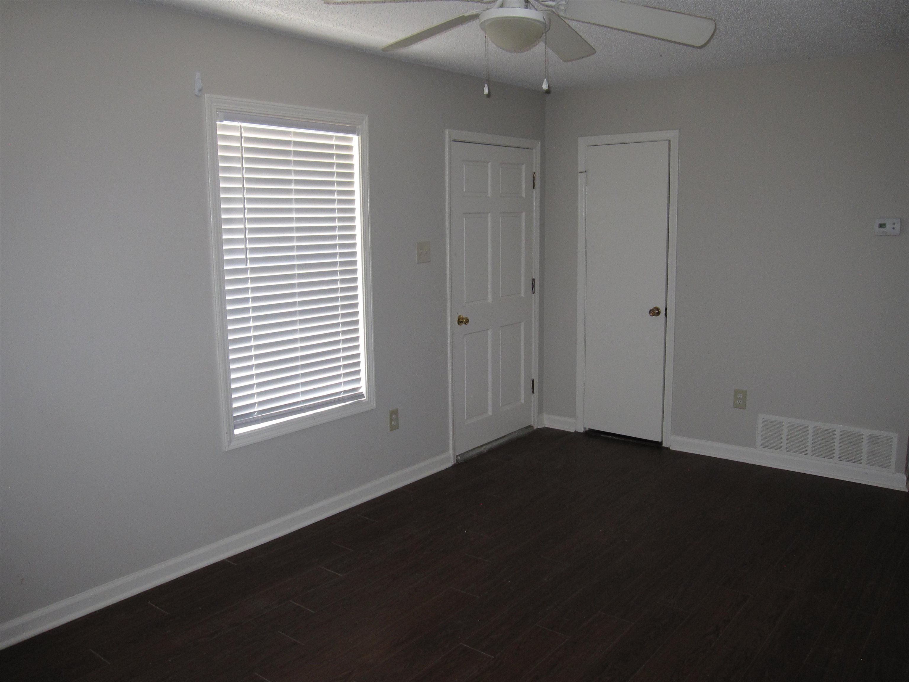 935 Poplar Leaf Road Collierville, TN 38017 - Photo 7 of 19 a view of an empty room with a window