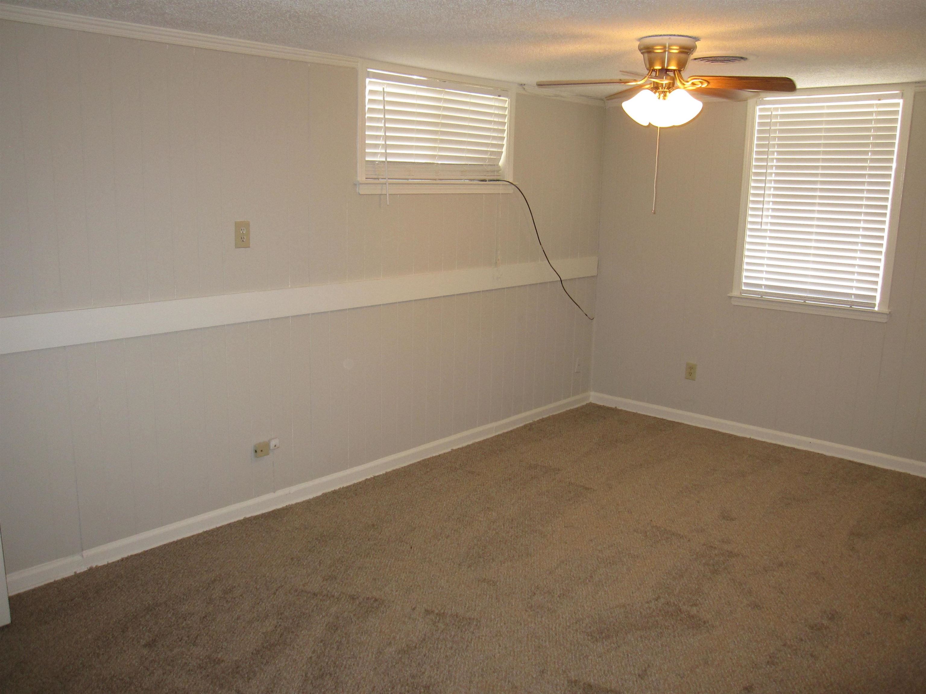 935 Poplar Leaf Road Collierville, TN 38017 - Photo 8 of 19 an empty room with windows and fan
