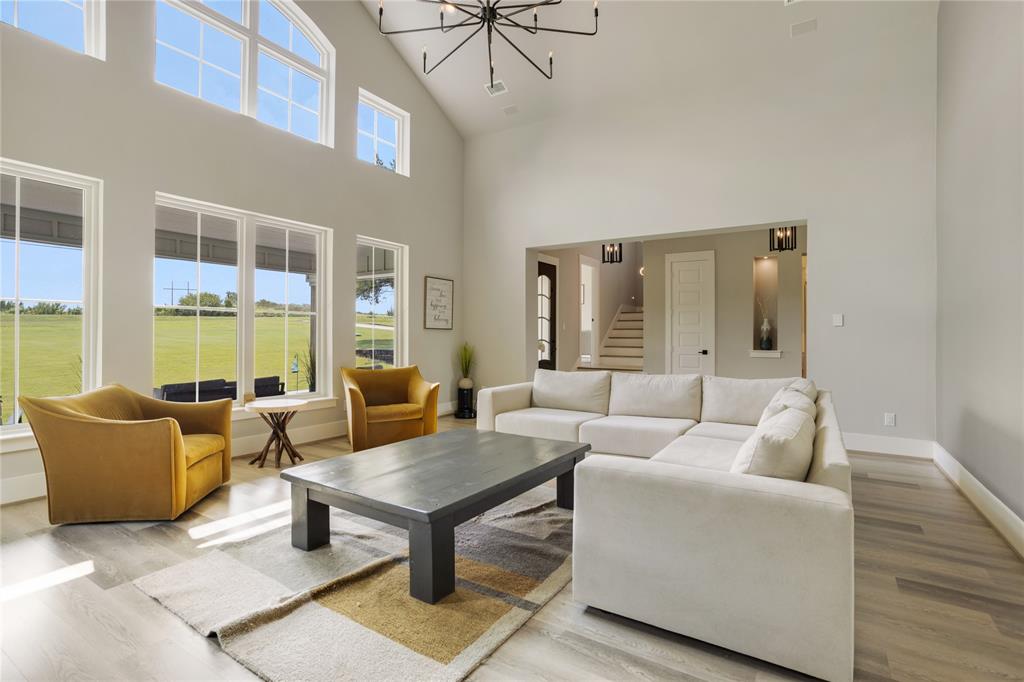 1095 Sister Grove Road Van Alstyne, TX 75495 - Photo 3 of 35 The great room has cathedral ceilings with a wall of gorgeous windows