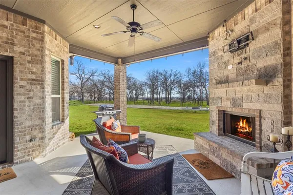 a outdoor space with patio fireplace furniture and garden