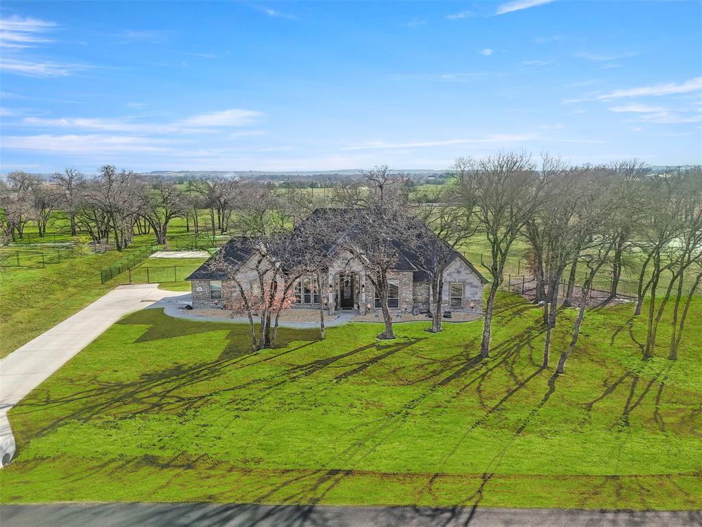 703 Winkler Way Springtown, TX 76082 - Photo 33 of 37 a view of a big yard with large trees