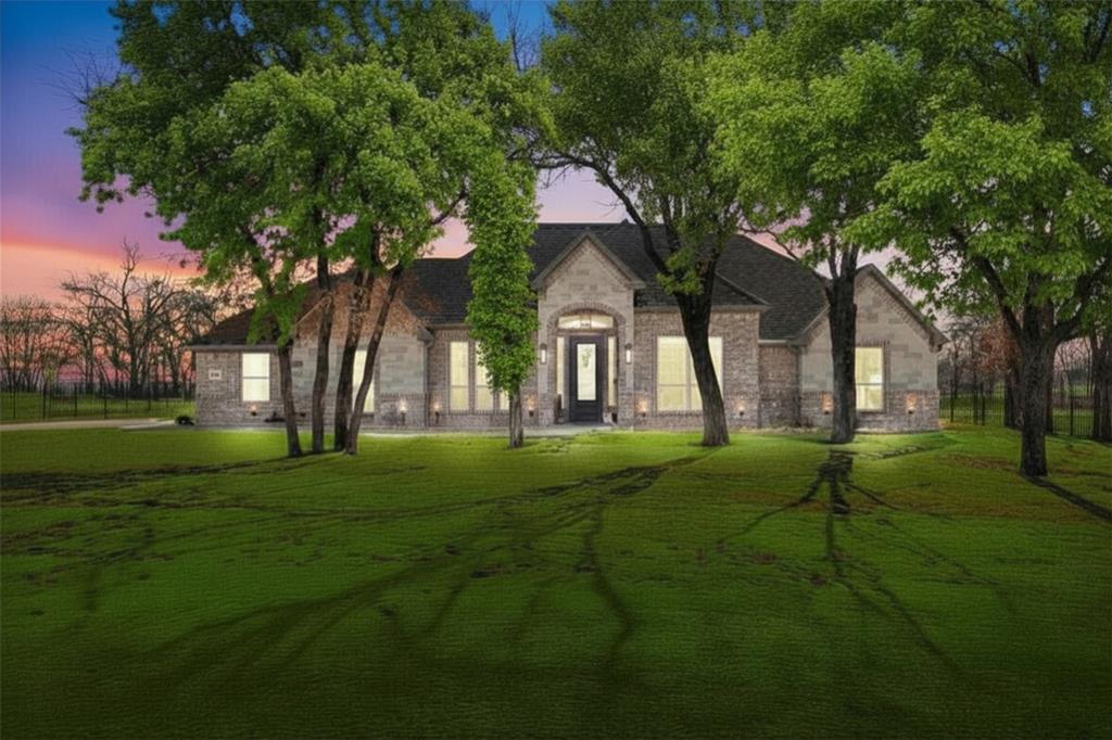 703 Winkler Way Springtown, TX 76082 - Photo 5 of 37 a backyard of a house with lots of green space and fountain