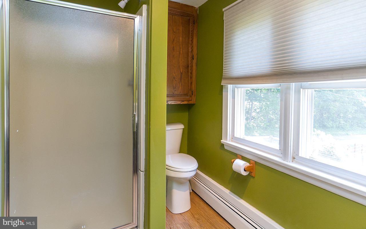 1004 Freeland Road Freeland, MD 21053 - Photo 14 of 30 a bathroom with a granite countertop sink and a large mirror