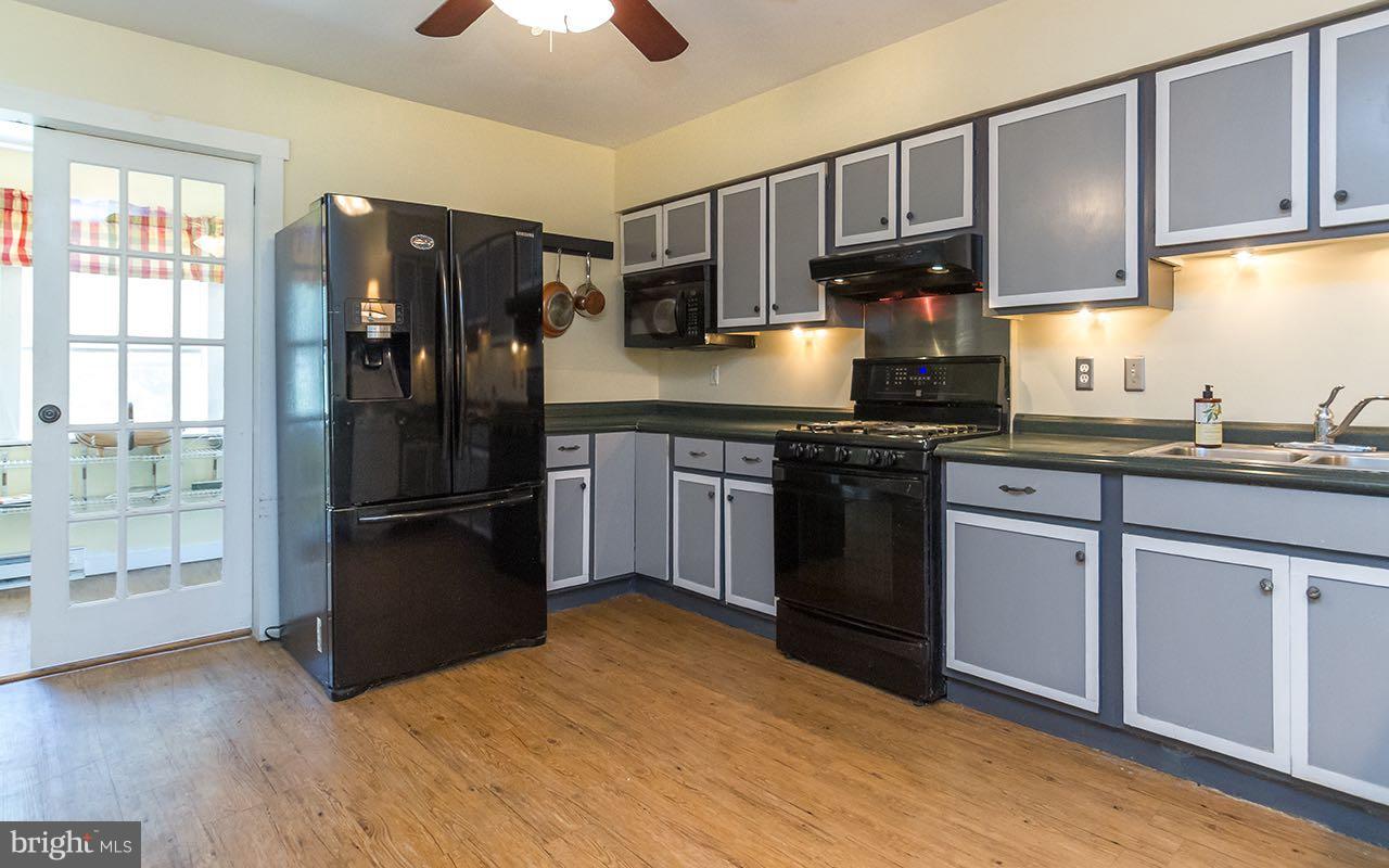 1004 Freeland Road Freeland, MD 21053 - Photo 19 of 30 a kitchen with stainless steel appliances granite countertop a refrigerator stove top oven a sink and dishwasher