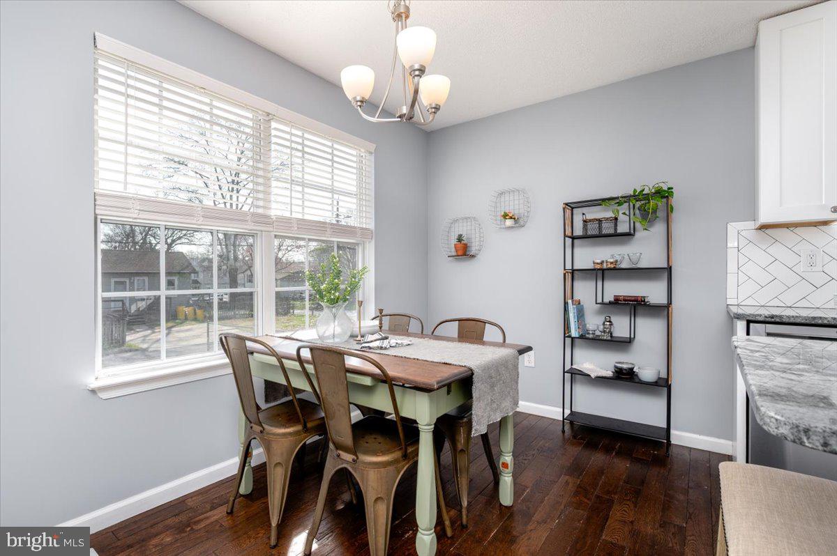 7804 East A E Shore Road Pasadena, MD 21122 - Photo 14 of 34 a view of a dining room with furniture window and wooden floor