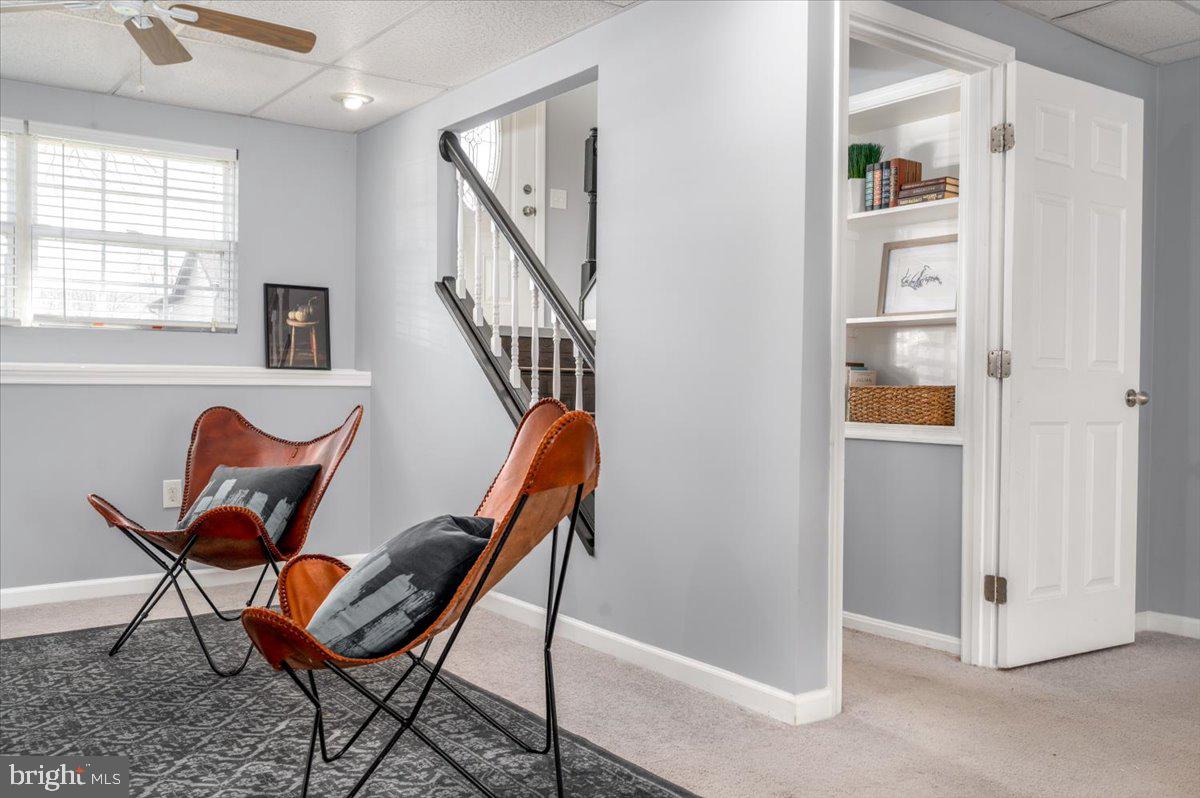 7804 East A E Shore Road Pasadena, MD 21122 - Photo 25 of 34 a view of a hallway with wooden floor and a dining room