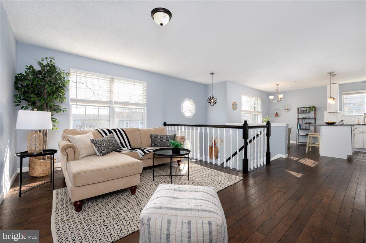 7804 East A E Shore Road Pasadena, MD 21122 - Photo 7 of 34 a living room with furniture and a wooden floor