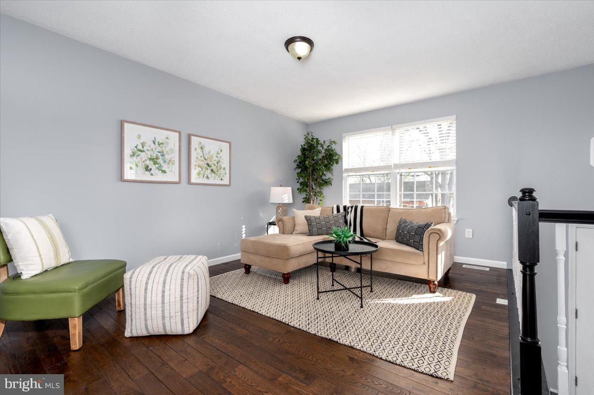 7804 East A E Shore Road Pasadena, MD 21122 - Photo 9 of 34 a living room with furniture wooden floor and a window