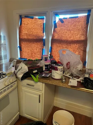 a room with a stove and a window