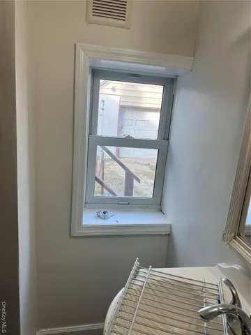 an empty room with wooden floor