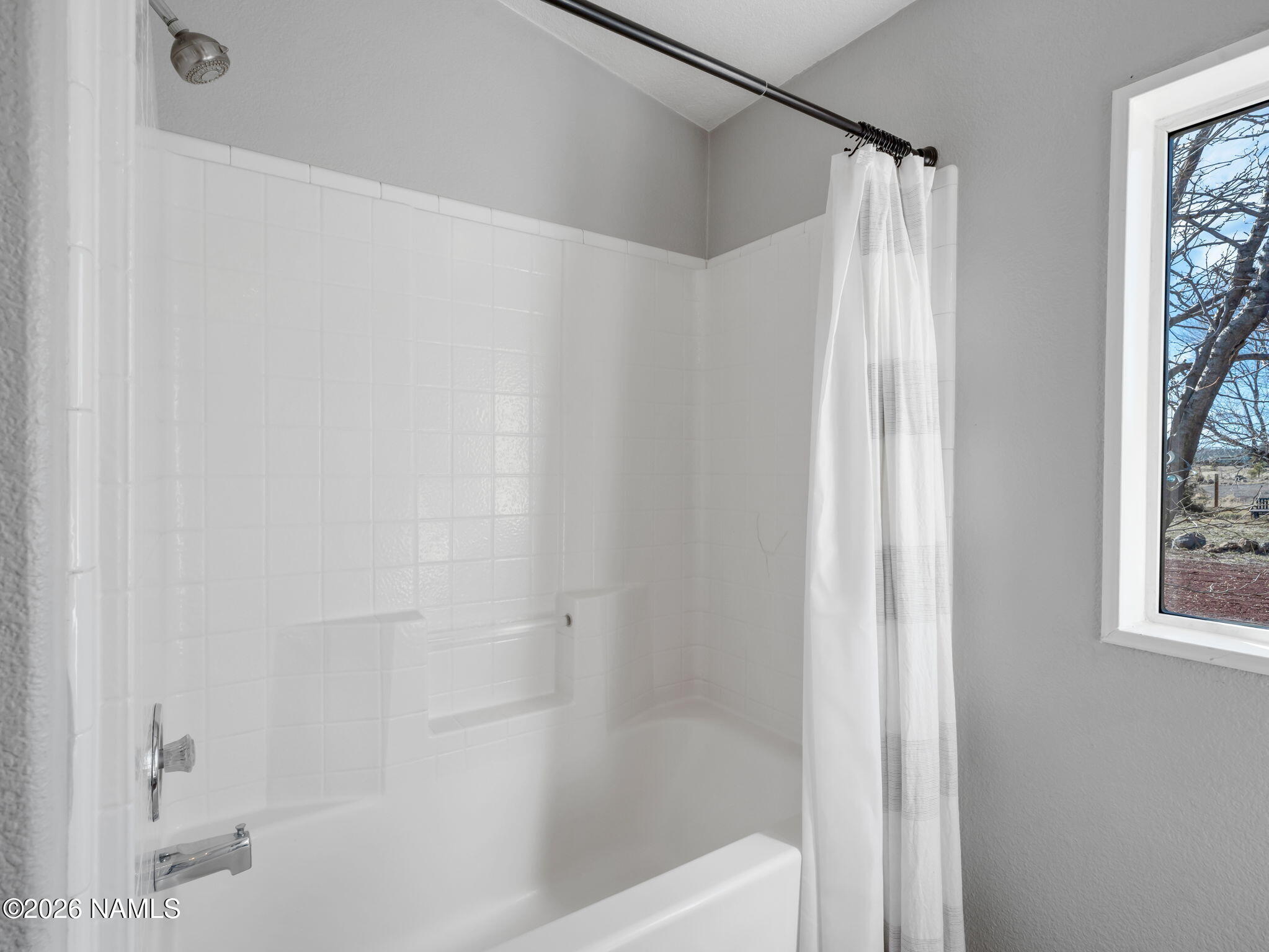 3095 North Peak View Road Williams, AZ 86046 - Photo 19 of 37 a bathroom with a bathtub and a shower