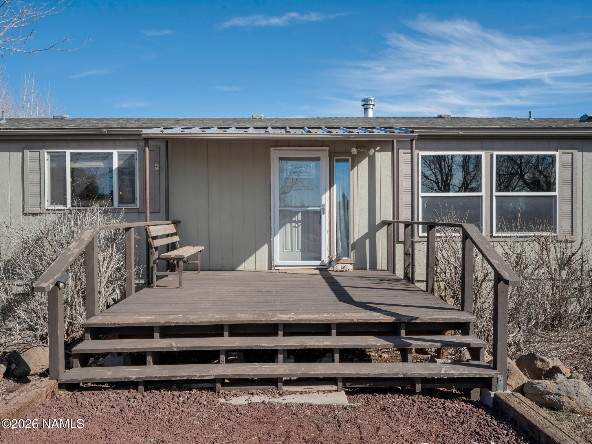 3095 North Peak View Road Williams, AZ 86046 - Photo 2 of 37 a view of a house with a balcony and wooden floor