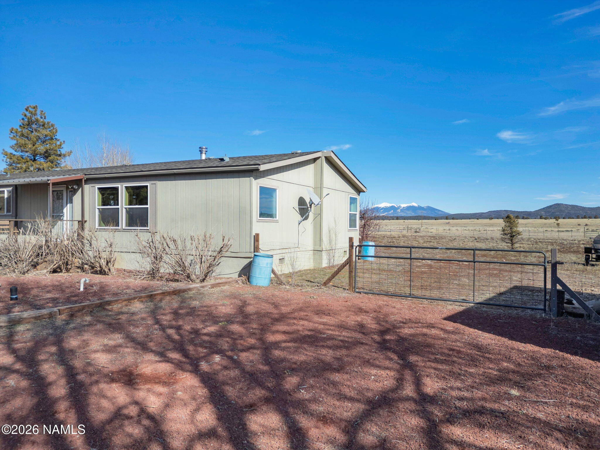 3095 North Peak View Road Williams, AZ 86046 - Photo 27 of 37 a view of a house with backyard and sitting area