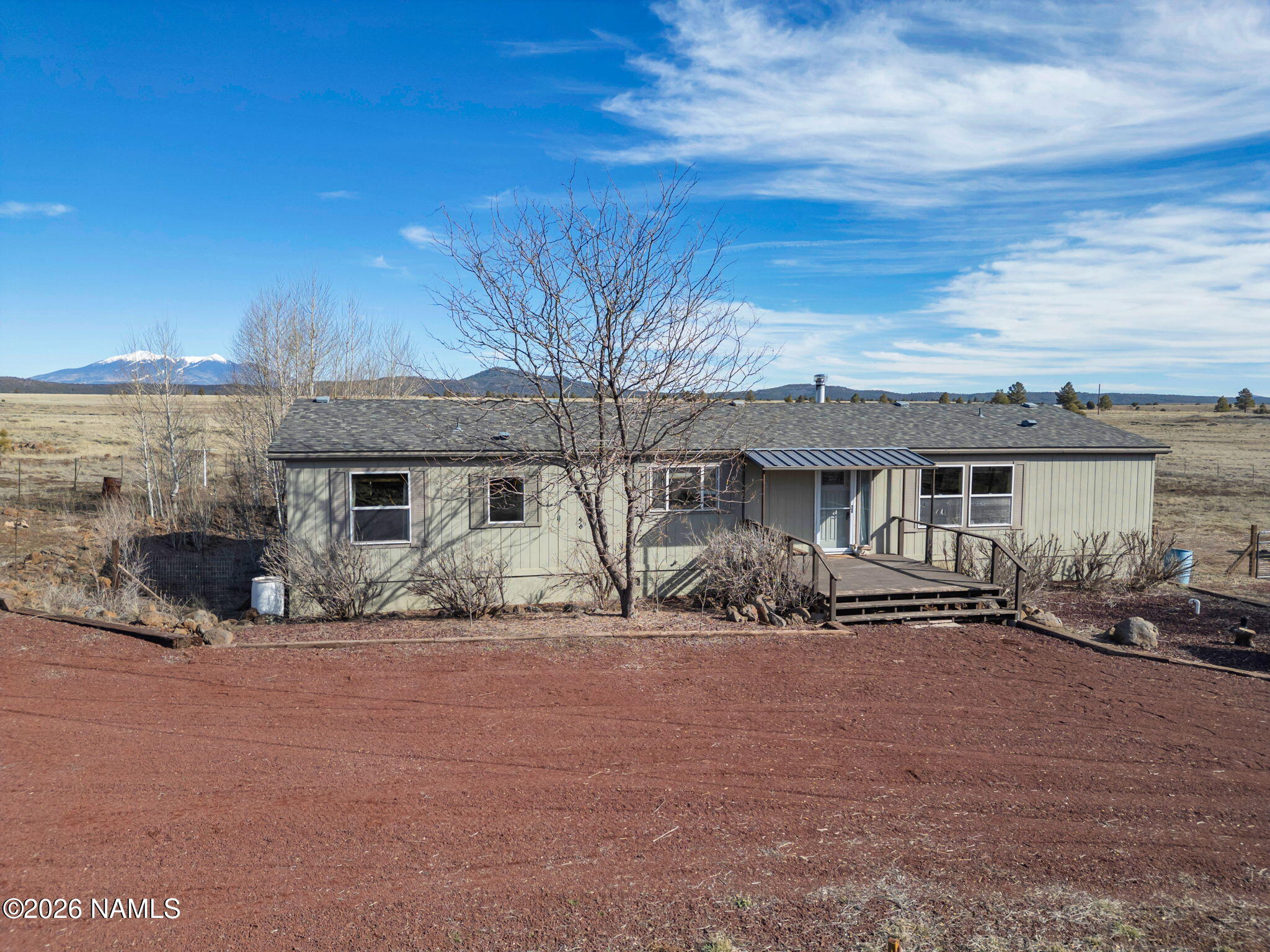 3095 North Peak View Road Williams, AZ 86046 - Photo 31 of 37 a front view of a house with large trees