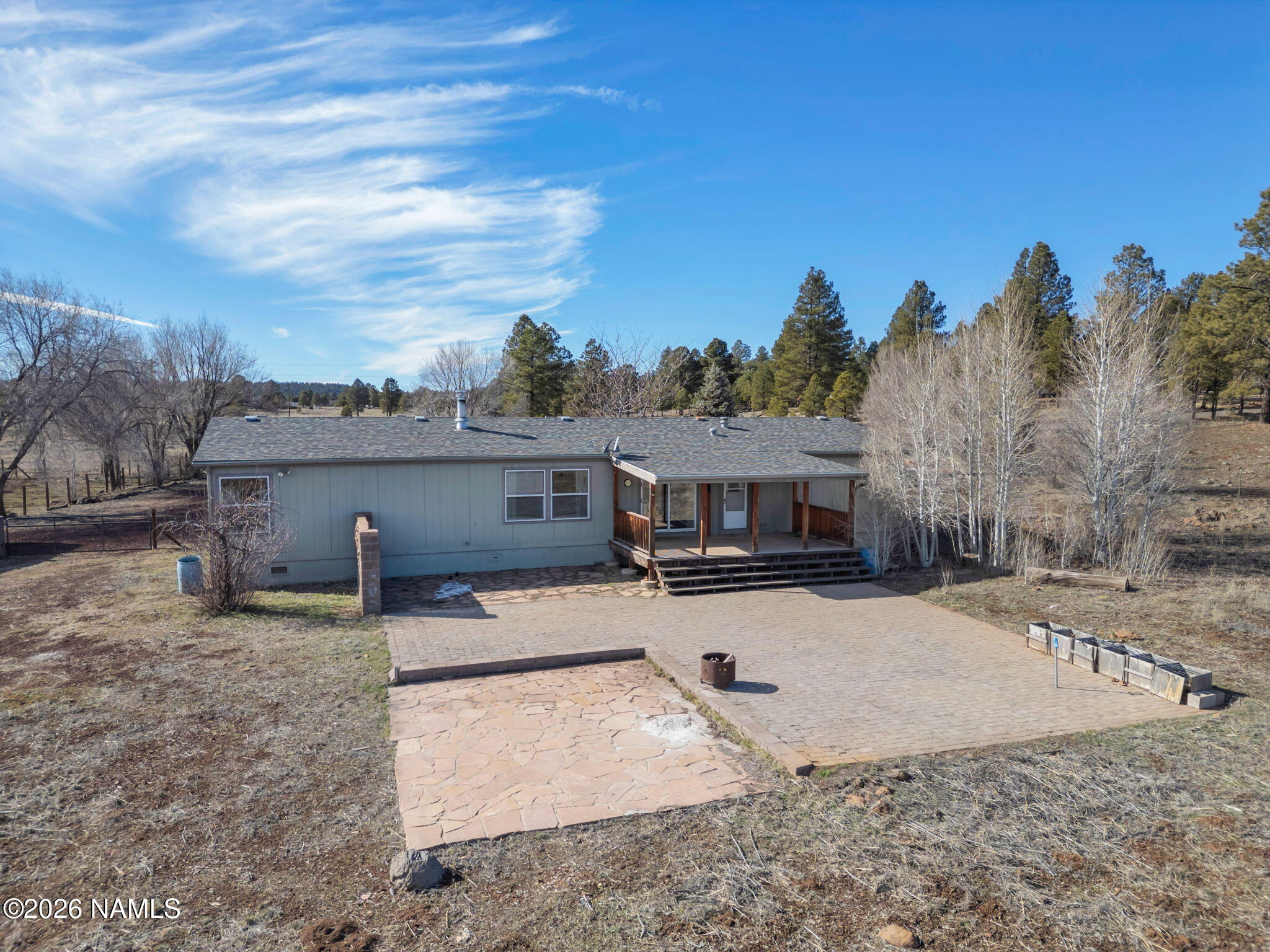 3095 North Peak View Road Williams, AZ 86046 - Photo 32 of 37 a view of a house with a yard covered in snow