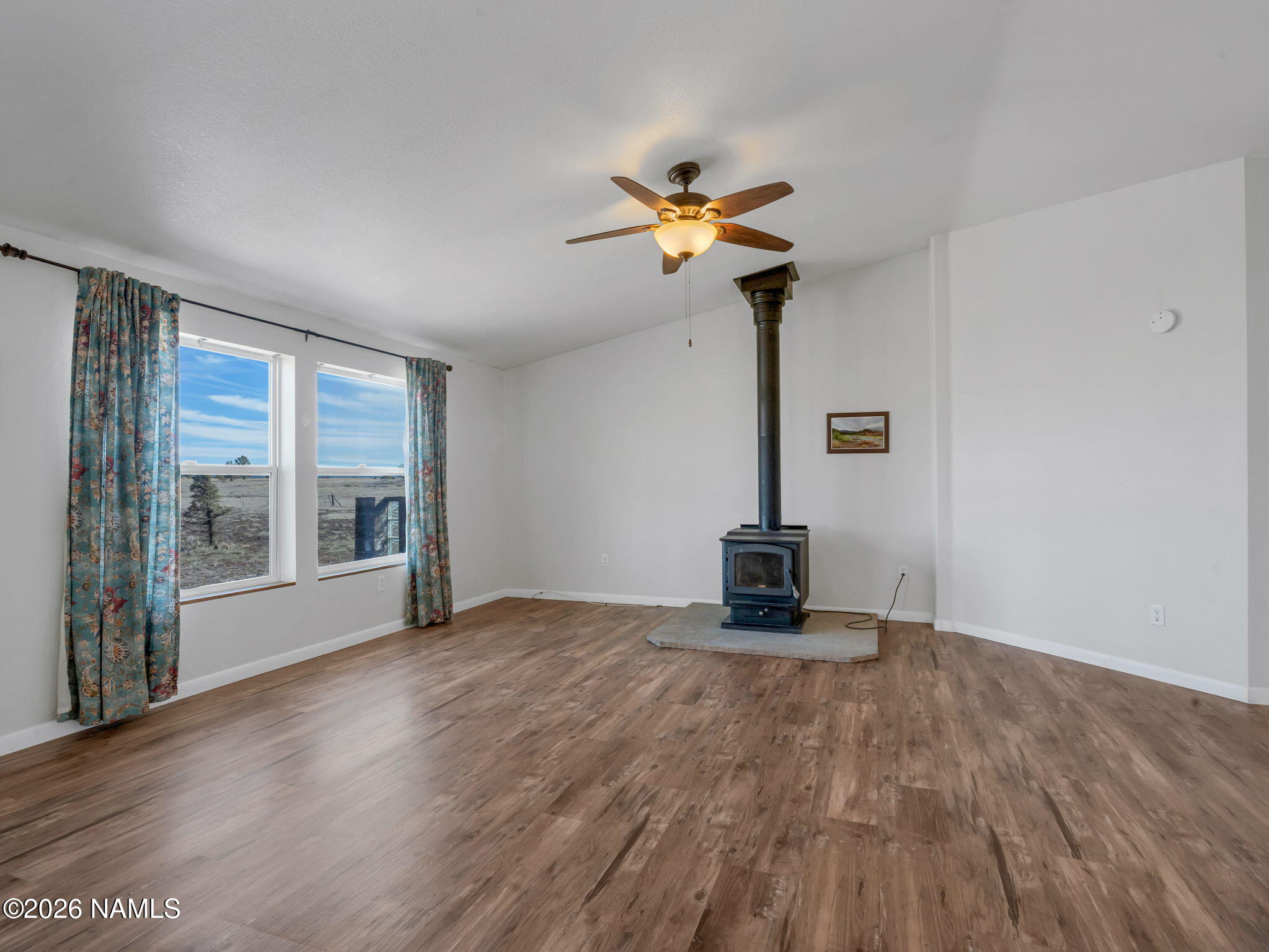 3095 North Peak View Road Williams, AZ 86046 - Photo 5 of 37 a view of an empty room with a window