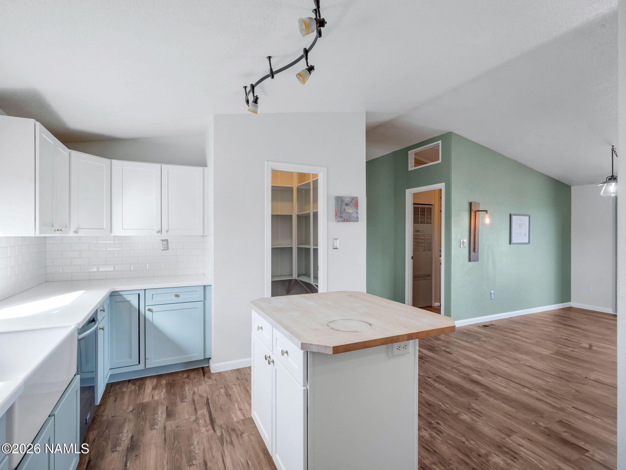 3095 North Peak View Road Williams, AZ 86046 - Photo 10 of 37 a kitchen with a sink cabinets and wooden floor