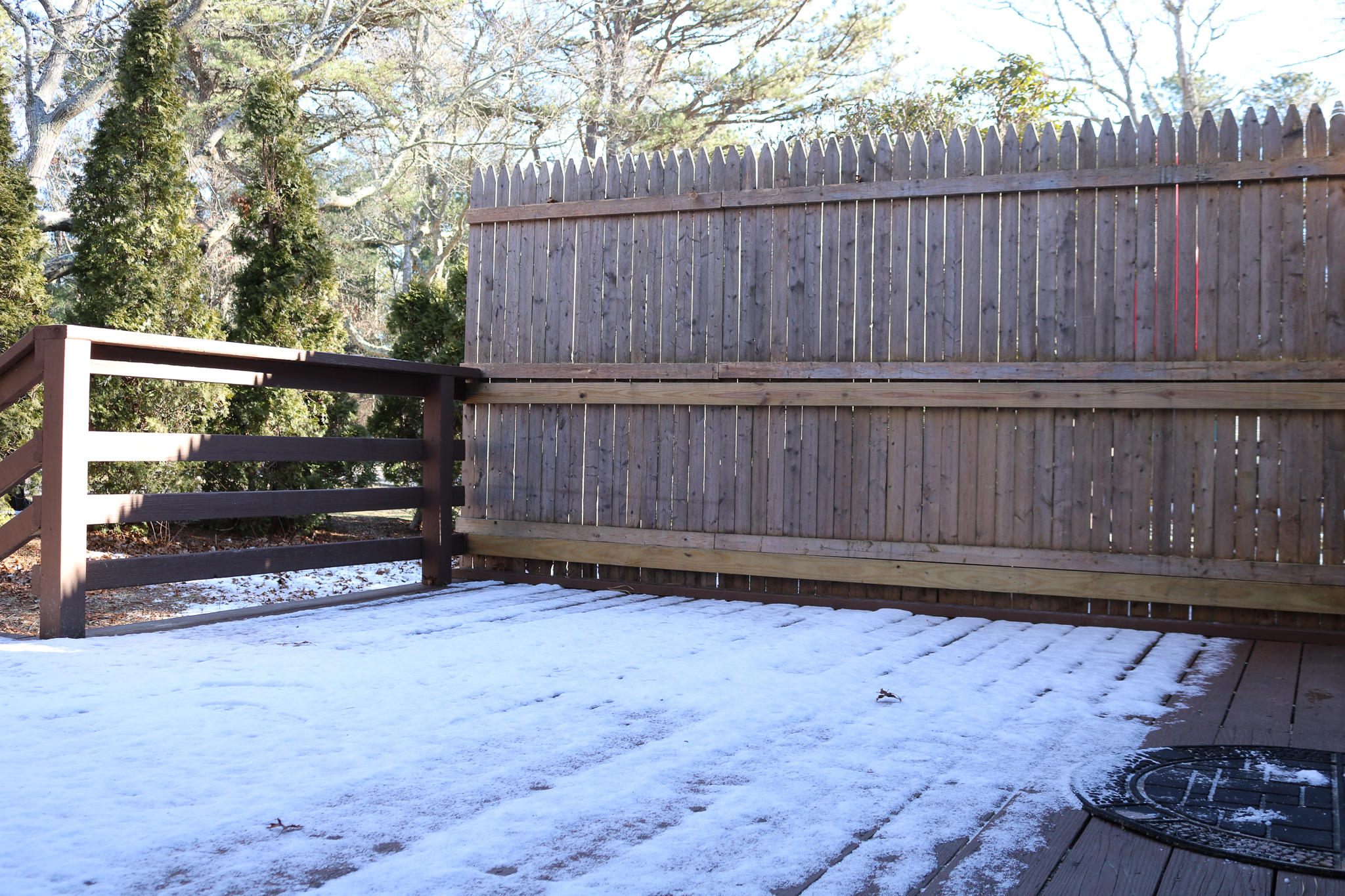 19 Round House Road, Unit 19 Bourne, MA 02532 - Photo 50 of 58 a view of a backyard with wooden fence