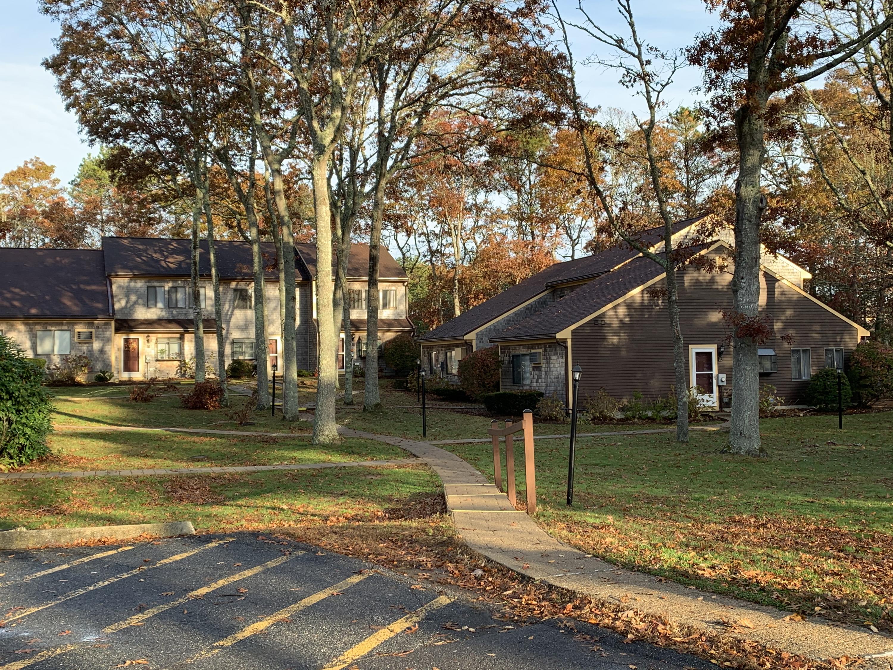 19 Round House Road, Unit 19 Bourne, MA 02532 - Photo 8 of 58 a view of a house with a big yard