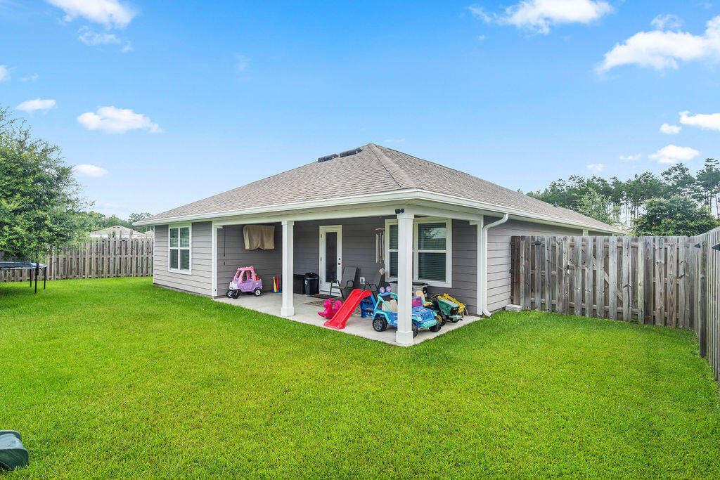 510 Earl Godwin Road Freeport, FL 32439 - Photo 32 of 42 a view of an house with backyard space and balcony