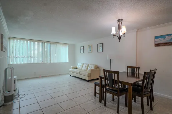 a view of a livingroom with furniture and chandelier
