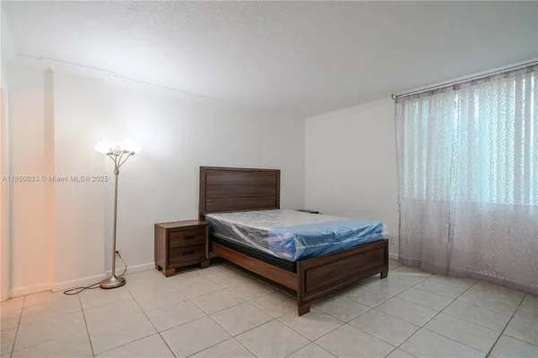 a bedroom with a bed and a table