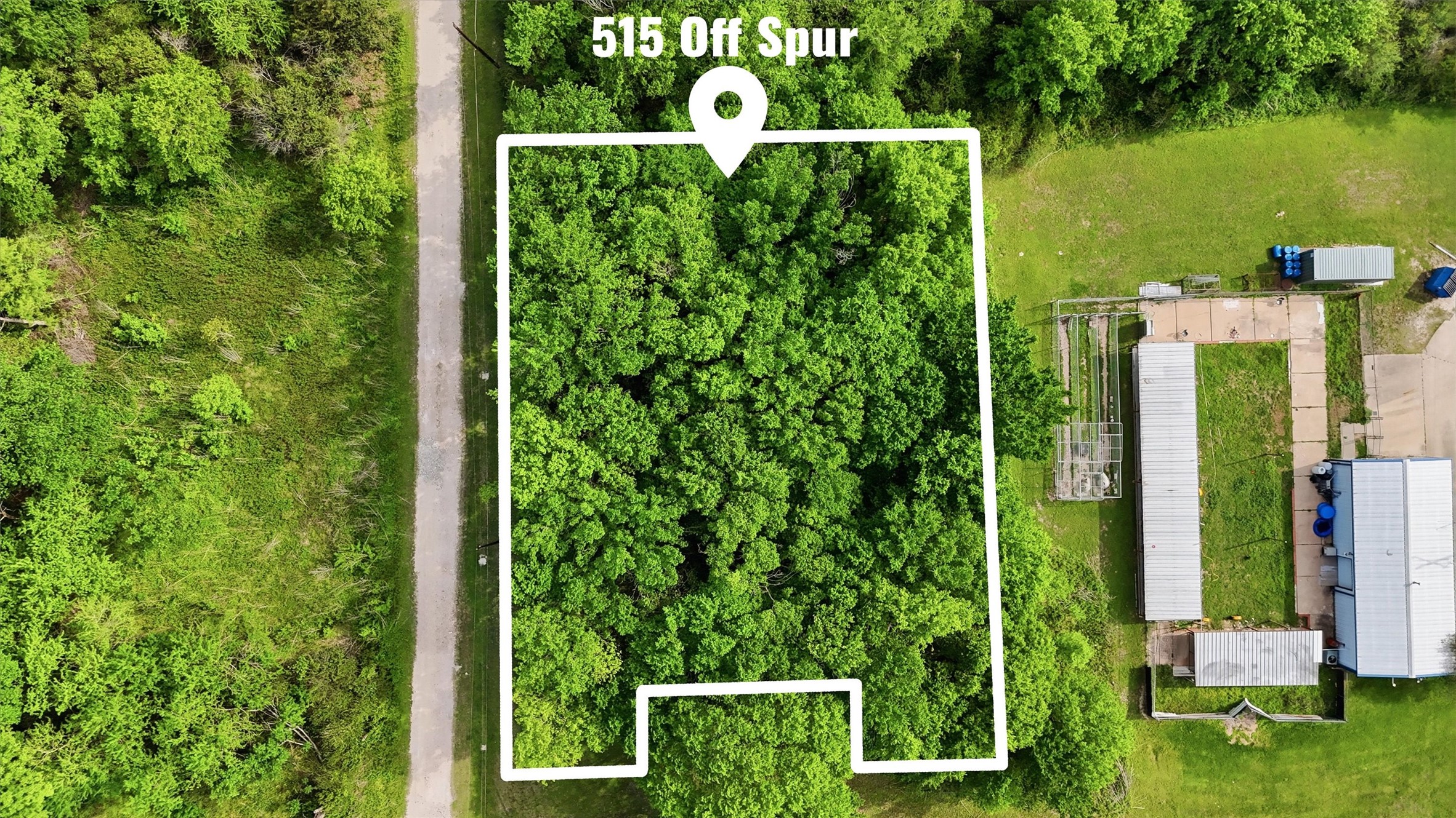 515 Off Spur Navasota, TX 77868 - Photo 1 of 13 a view of a yard with chairs