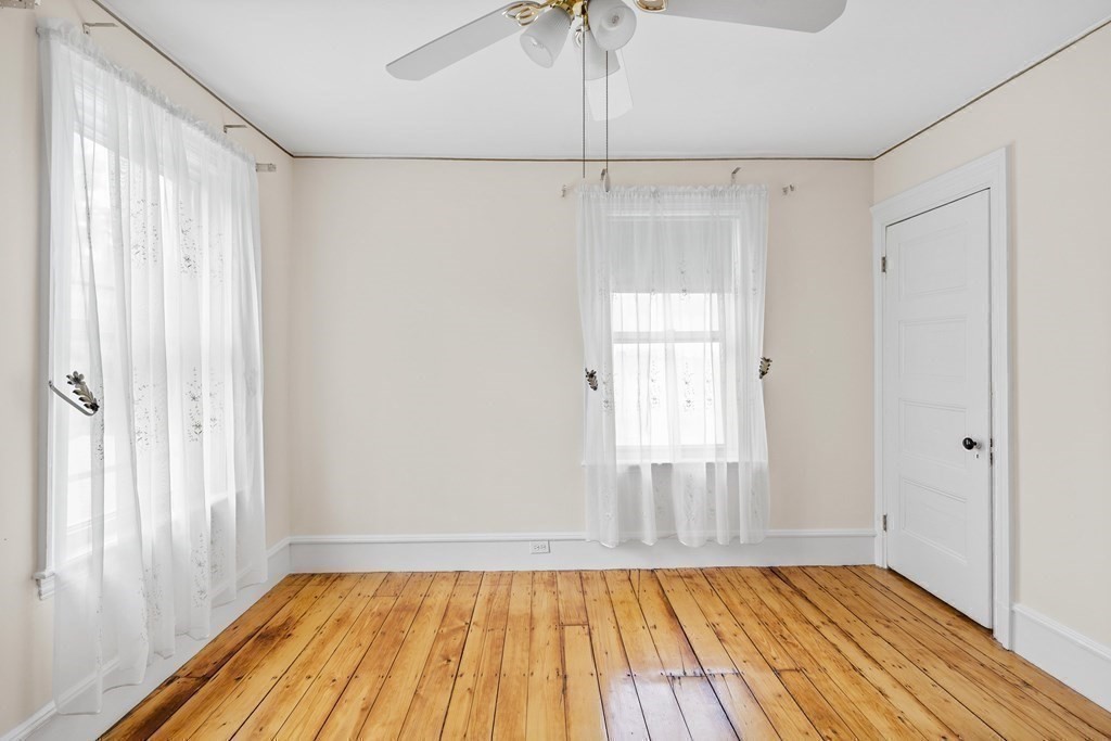 130 Dickerman Road Newton, MA 02461 - Photo 15 of 29 a view of empty room with wooden floor and fan