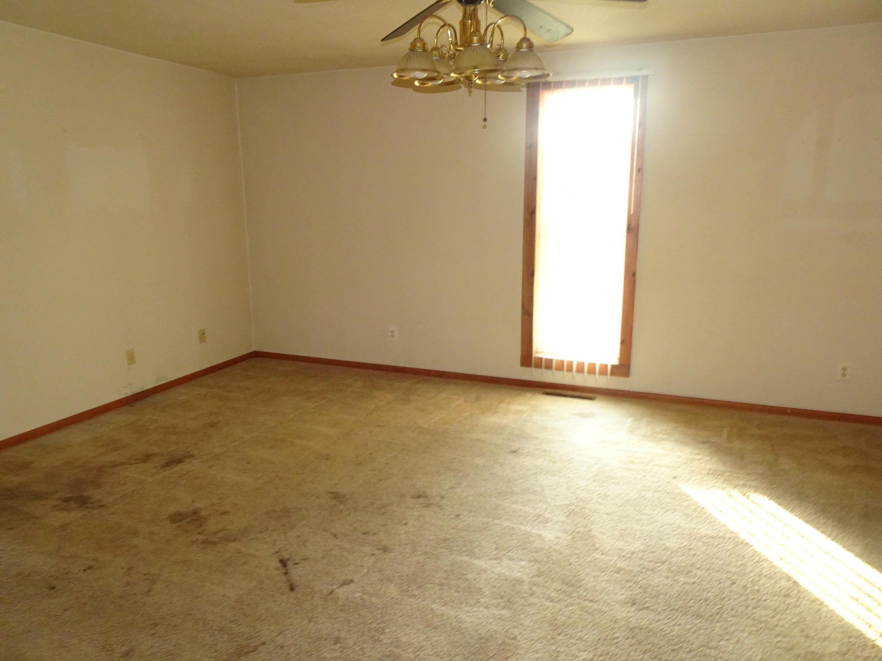 330 East Elm Street Rensselaer, IN 47978 - Photo 4 of 13 an empty room with a windows