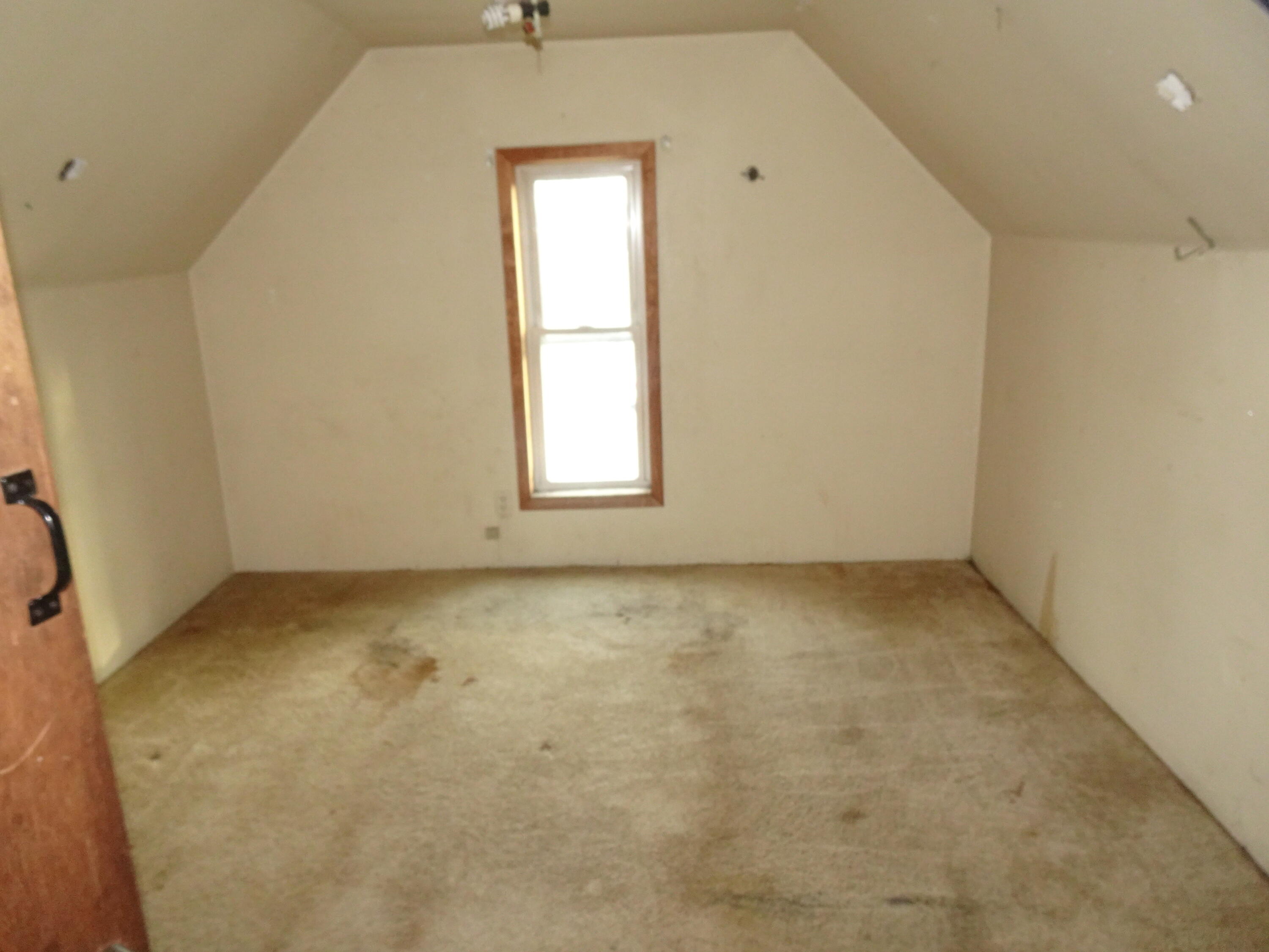 330 East Elm Street Rensselaer, IN 47978 - Photo 7 of 13 an empty room with a window