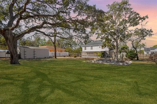 a view of a house with a big yard