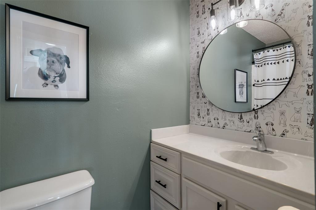 11258 Lomita Wren Road Weeki Wachee, FL 34614 - Photo 34 of 46 a bathroom with a sink mirror and toilet