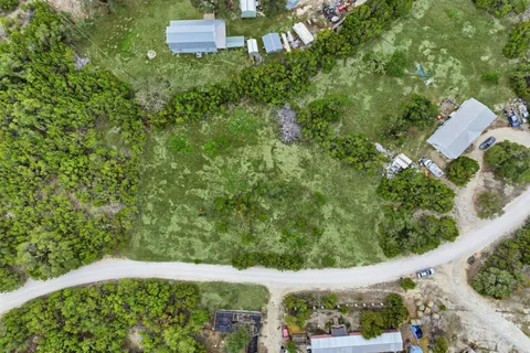 a view of a yard from a balcony