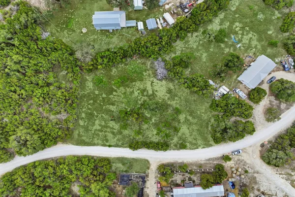 a view of a yard from a balcony