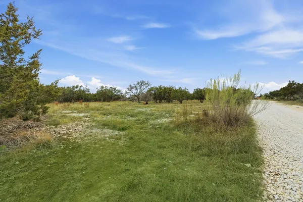 a view of a lake from a yard