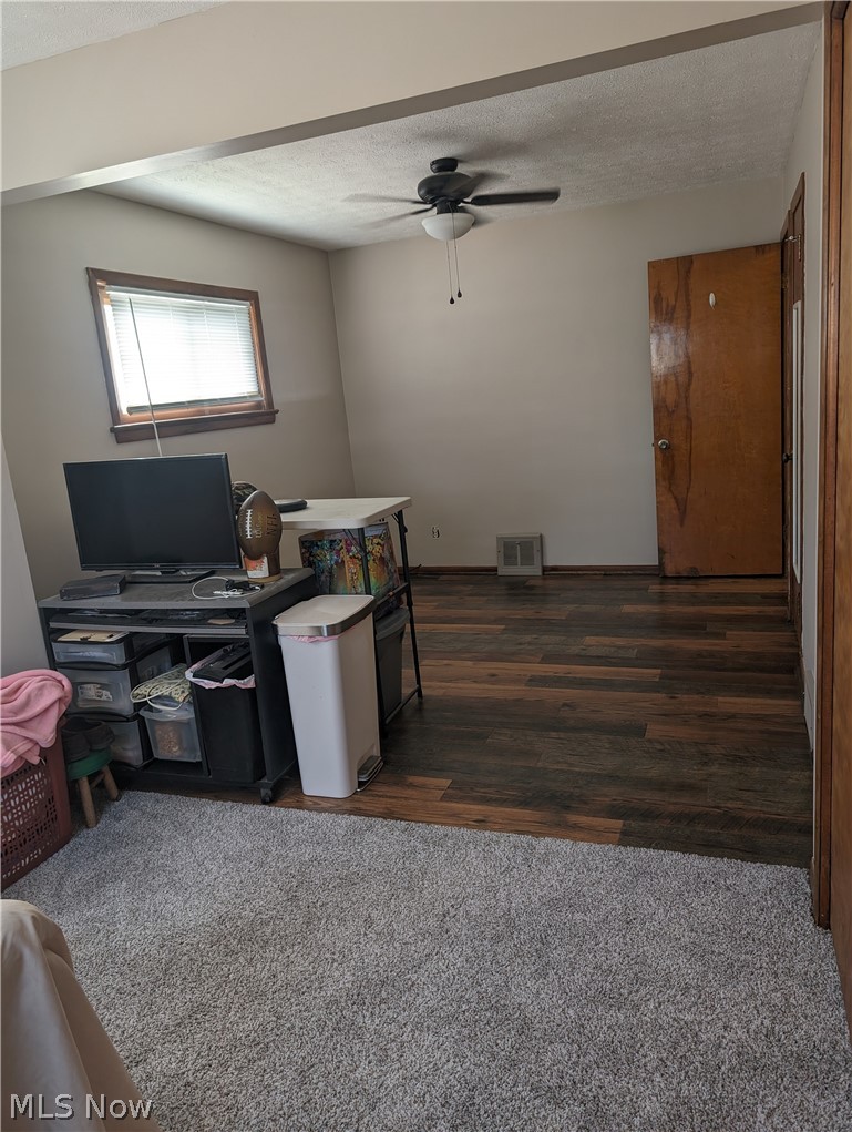 30213 Barjode Road Willowick, OH 44095 - Photo 11 of 20 Office with ceiling fan, a textured ceiling, and dark wood-type flooring