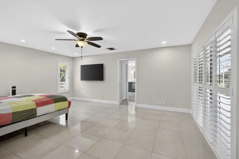 a bedroom with furniture and window