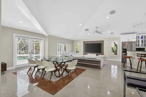 a living room with lots of furniture and a flat screen tv