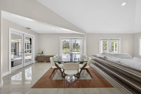 a kitchen with stainless steel appliances kitchen island granite countertop a refrigerator and a stove top oven