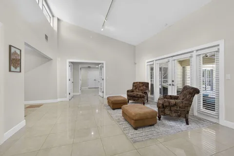 a bathroom with a granite countertop sink toilet a mirror and shower