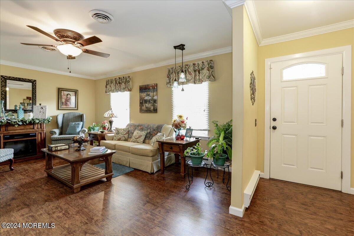 14 Ashley Road, Unit 63 Whiting, NJ 08759 - Photo 12 of 54 a living room with furniture and a chandelier