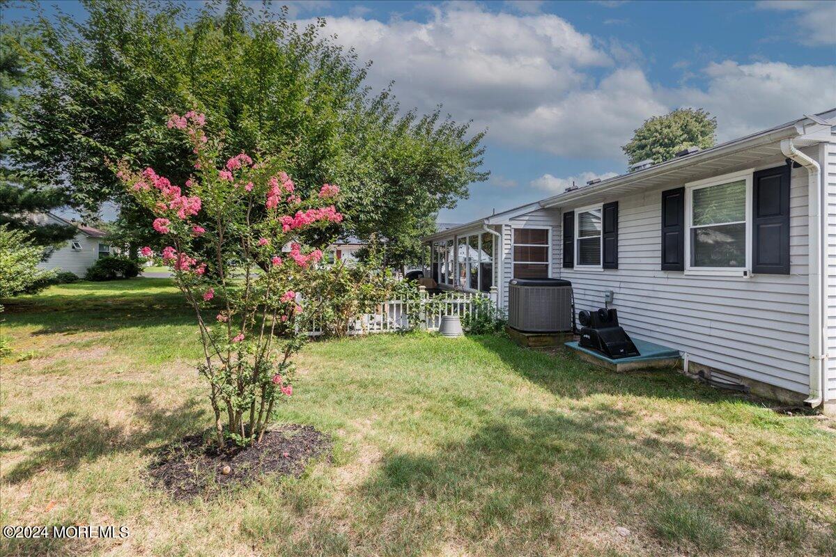 14 Ashley Road, Unit 63 Whiting, NJ 08759 - Photo 54 of 54 a backyard of a house with lots of green space