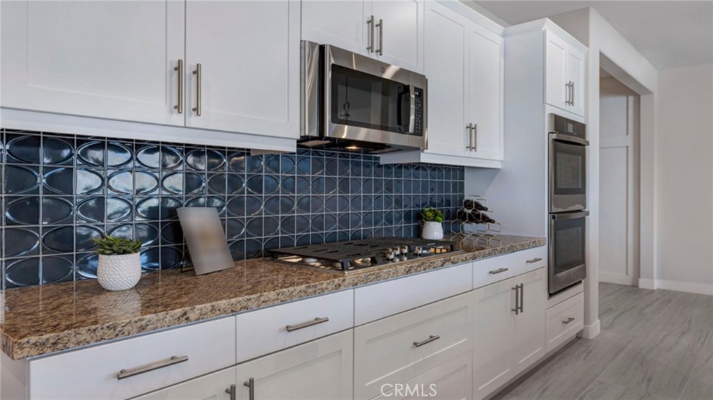 533 Havasu Way Rialto, CA 92377 - Photo 4 of 21 a kitchen with a sink and cabinets