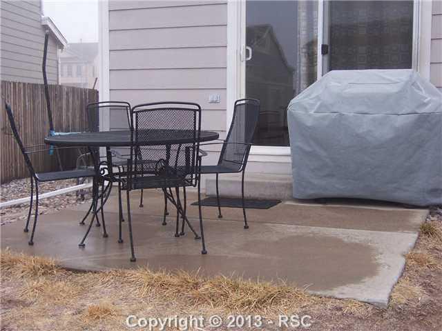 7879 Coffee Road Peyton, CO 80831 - Photo 8 of 8 Neat Patio Off Of Kitchen; Enjoy Colorado Outdoor Living!