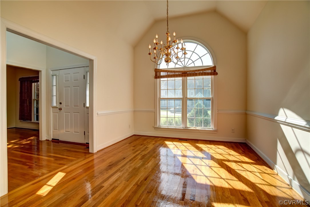 858 Club Ridge Terrace Chester, VA 23836 - Photo 4 of 29 wooden floor in an empty room with a window