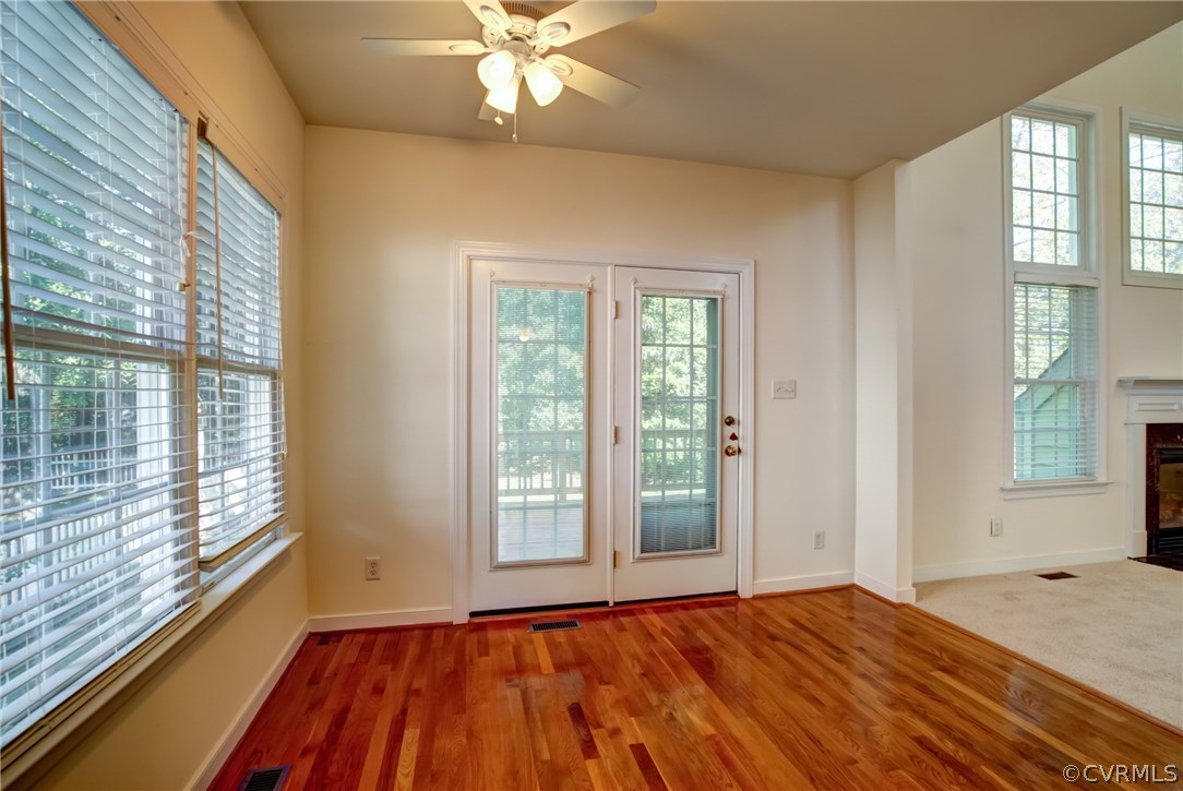 858 Club Ridge Terrace Chester, VA 23836 - Photo 6 of 29 a view of an empty room with a window and wooden floor