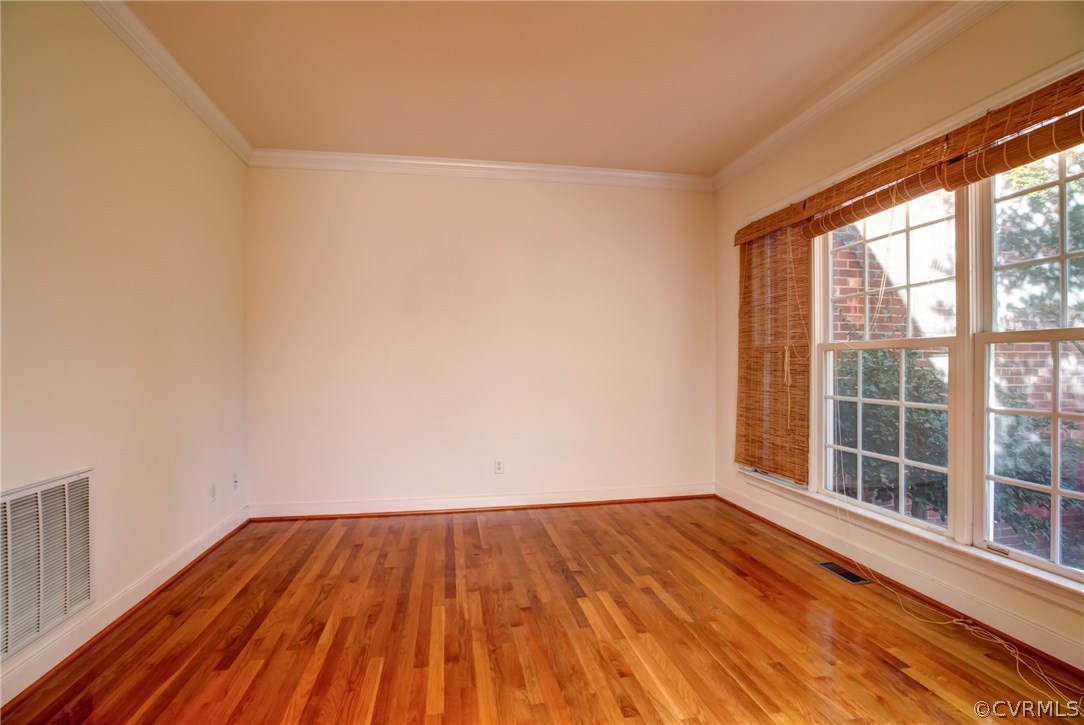 858 Club Ridge Terrace Chester, VA 23836 - Photo 7 of 29 an empty room with wooden floor and windows