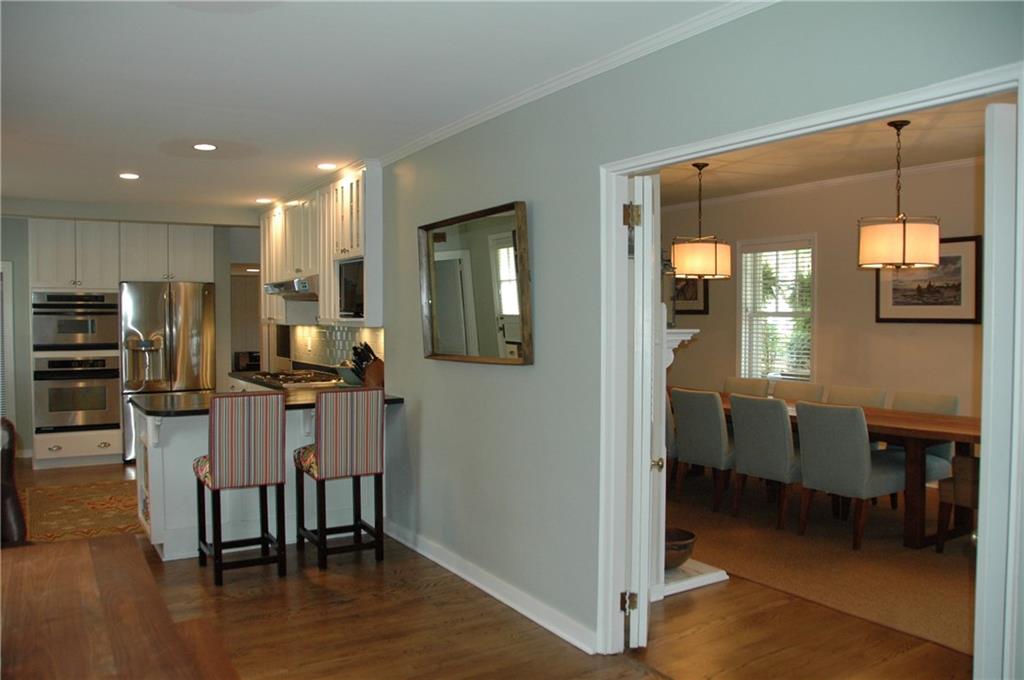 303 Pine Road Edgeworth, PA 15143 - Photo 11 of 24 a kitchen with a dining table chairs and refrigerator