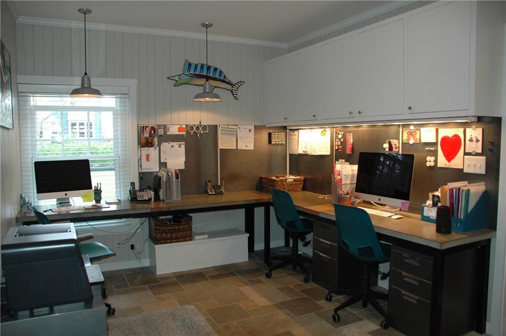 303 Pine Road Edgeworth, PA 15143 - Photo 12 of 24 Family office area with room for everyone at concrete counter with unique metal backsplash for hanging art and papers. Stone floor has radiant heat. Lots of storage!